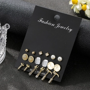 Set of 9 pairs of mixed stud earrings featuring tool shapes, pearls and crystals