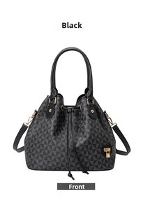 Front detail of printed bucket bag with geometric patterns and golden lion pendant