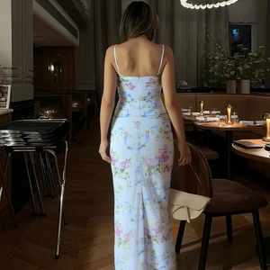 Elegant back view of floral slip dress with open back and high slit detail on the side