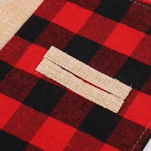 Close-up of red and black buffalo plaid fabric stitched with natural coarse burlap texture