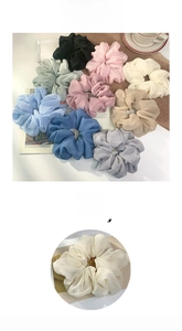 Detail showing oversized silk chiffon scrunchies in 9 assorted Morandi colors