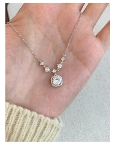 Detailed view of S925 sterling silver necklace with pink square zirconia pendant on hand