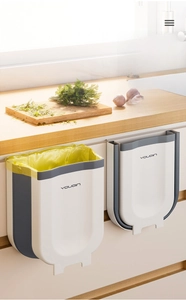 Foldable wall-mounted kitchen waste bin with space-saving hanging design in white and grey