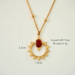 Detailed view of red agate pendant with dimensions 2.3cm x 1.8cm and 40+5cm gold chain