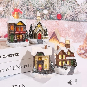 Set of 4 lighted Christmas village houses with snowy European style resin buildings