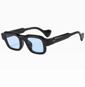 Close-up of stylish square black frame sunglasses with light blue lenses and geometric temples