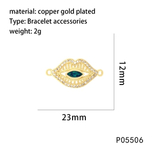 Macro detail of lip-shaped connector with blue zircon in gold-plated copper, 23mm size