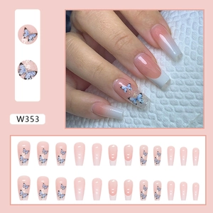 Elegant long coffin press-on nails featuring French ombre and blue butterfly nail art