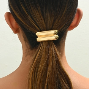 Minimalist golden geometric metal hair ring cuff ponytail holder on model hair