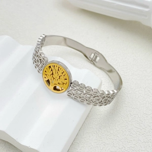 Titanium steel tree of life bangle featuring silver hollow chain and gold center emblem