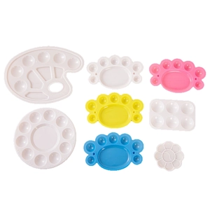 Variety of plastic paint palettes in foot and flower shapes for students and artists