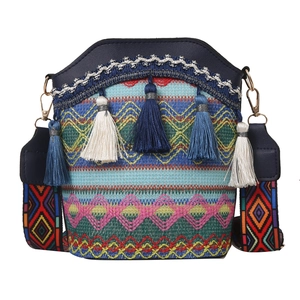 Ethnic bohemian bucket bag with colorful woven patterns and tassel details