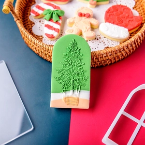 Christmas cookie cutter set featuring gingerbread man and tree shapes for holiday baking