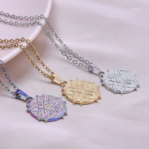 Detailed view of goat head pentagram pendants in gold, silver, and rainbow finishes