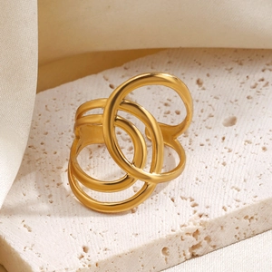 Three-layer crisscross gold-plated stainless steel open ring on a stone base with silk