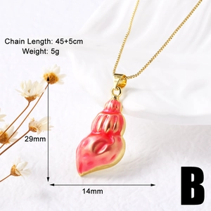 Detailed view of conch shell pendant necklace with red gradient and gold dimensions