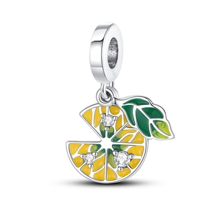 Detailed view of silver lemon charm with yellow enamel, green leaf, and small crystals