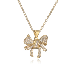 Gold bow pendant necklace with sparkling cubic zirconia on an elegant O-chain