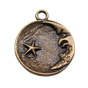 Antique bronze round moon and stars pendant with textured celestial relief design