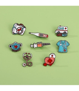 Detailed flat lay of medical enamel pins set with syringe and stethoscope designs