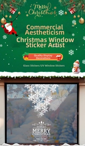 Close-up of white snowflake static stickers on a window for Christmas decoration