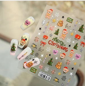 Detail of Christmas nail stickers with cute bears, trees and snowflakes for nail art design