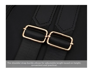 Detail of adjustable nylon shoulder straps with light gold rectangular metal buckles