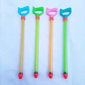 Detailed view of four pull-out plastic water guns in assorted macaron colors