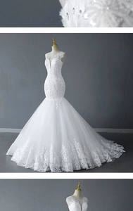 Detail of white mermaid wedding dress featuring lace embroidery and beaded sequins train