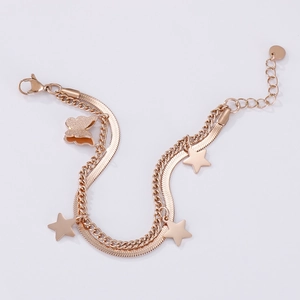Double-layered rose gold bracelet featuring star charms and a glittery butterfly pendant