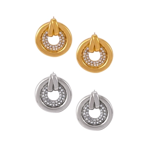 Exaggerated gold and silver round stud earrings with micro-pave cubic zirconia crystals