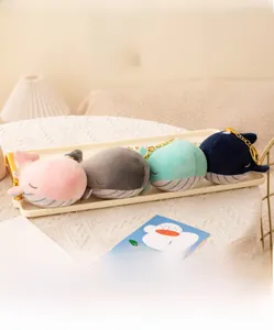 Detail of plush whale keychains in four colors with high-quality metal chains and stitching