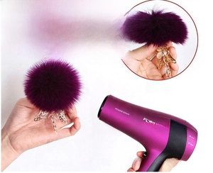 Close-up showing purple plush keychain fluff restored by hairdryer for fluffy effect