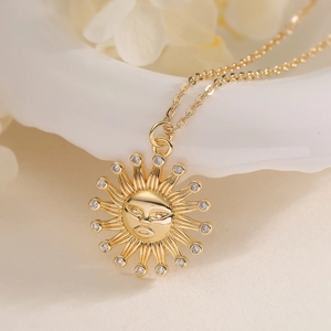 Elegant 18K gold plated sun pendant necklace with sparkling cubic zirconia on cross chain
