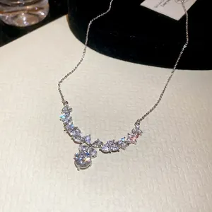 Elegant zircon flower pendant necklace in silver finish on a premium textured background