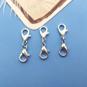 Detailed view of three silver zinc alloy double-ended lobster clasps for DIY jewelry