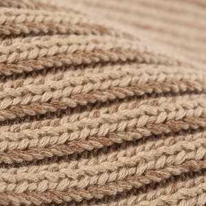 Winter thermal knit beanie hat showing close-up texture of warm brown ribbed cotton wool
