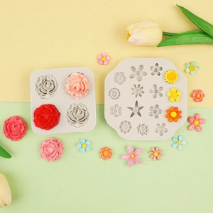 Detailed rose flower silicone molds with colorful fondant decorations on bicolor background