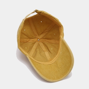 Mustard yellow baseball cap showing interior 6-panel structure and reinforced tape detail