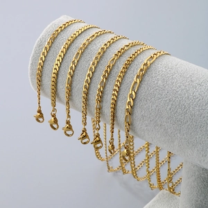 Set of 10 golden minimalist titanium steel layered anklets displayed on a professional stand