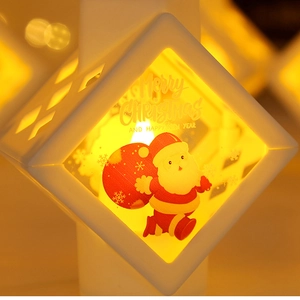 Christmas LED lantern with warm light and Santa Claus scene for holiday table decoration