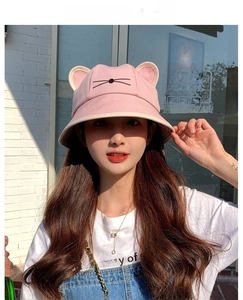 Detailed close-up of pink cotton sun hat with cute 3D cat ears and whiskers embroidery
