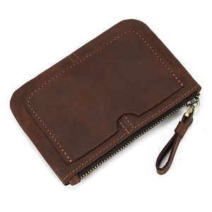 Detail of dark brown crazy horse leather coin purse with card slot and metal zipper