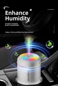 White cylinder car humidifier with colorful LED lights placed in a vehicle cup holder