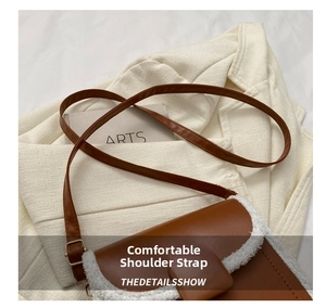 Detail of vintage brown leather crossbody bag with white faux fur trim and sleek shoulder strap