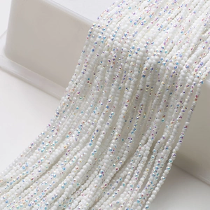 Close-up of faceted white AB crystal glass beads for DIY jewelry and necklaces