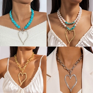Vintage multi-layer necklaces with faux pearls, turquoise beads and large heart pendants