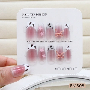 Handmade press-on nails with pink cat-eye leopard print and 3D bow accents