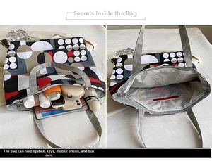 Detail view of printed canvas tote bag interior showing the main zipper pocket and capacity