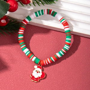 Detail of Christmas polymer clay bracelet with Santa Claus charm and festive beads